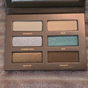 Urban Decay Eyeshadow Palette with Cream, Silver, and Green Shades